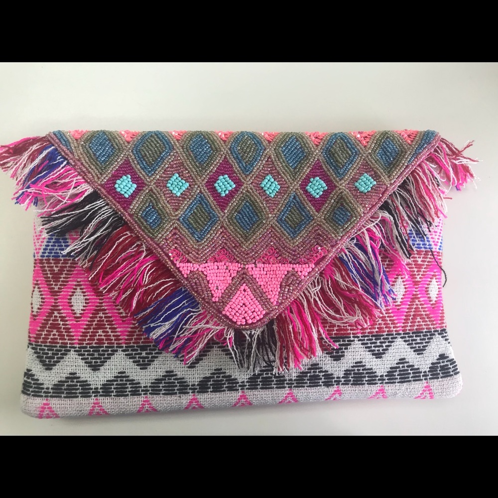 Handcrafted multi fringe clutch